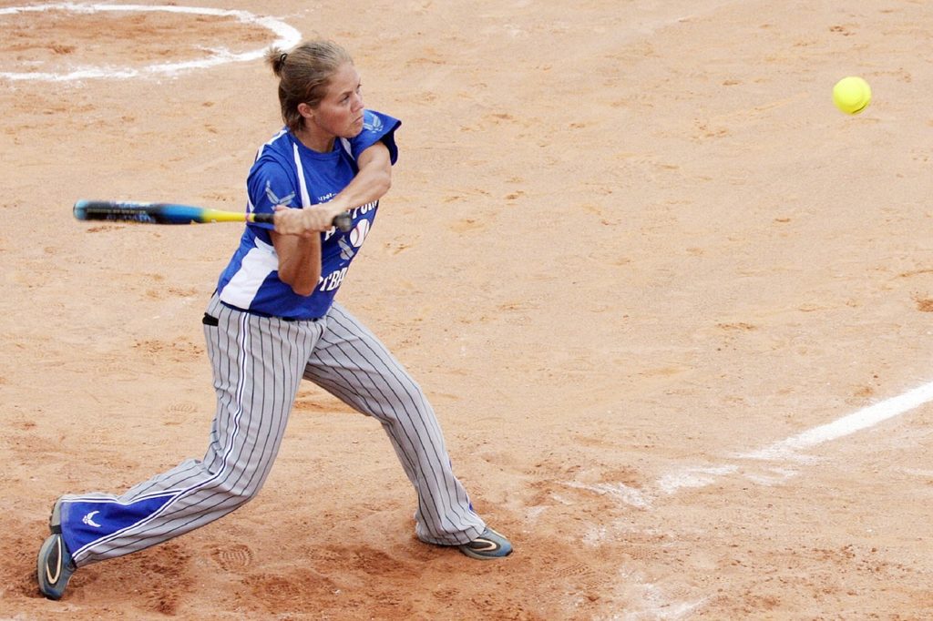 Girl swinging at a softball